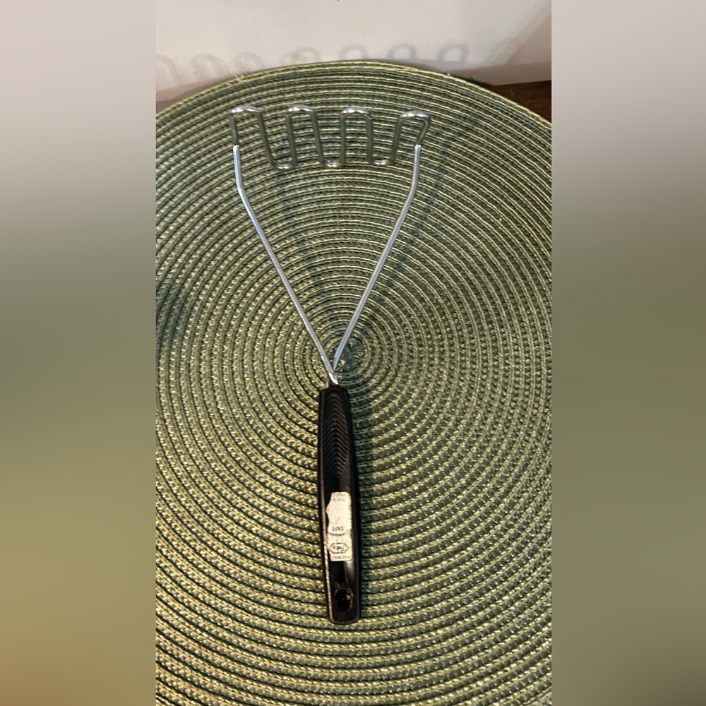 Vintage Foley potato masher black handle, and silver utensil Please Read Details